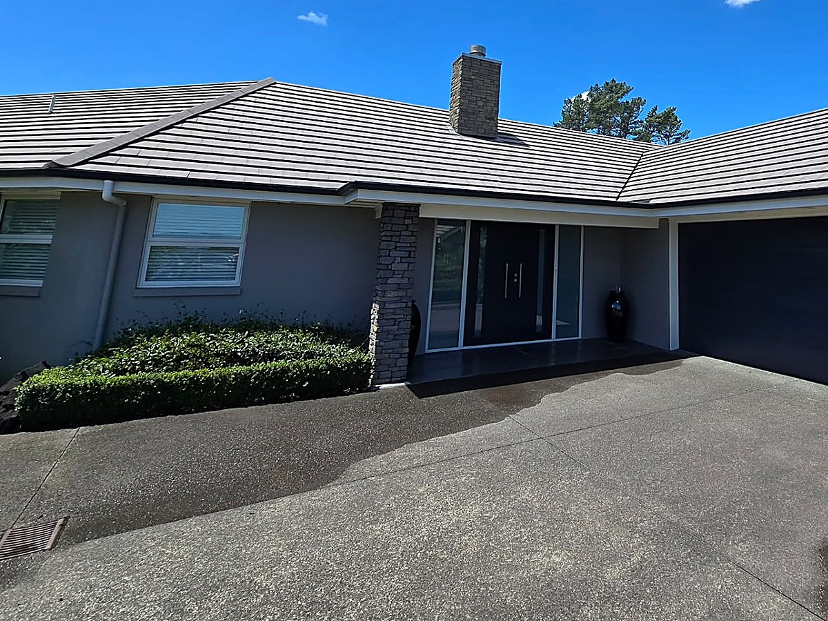 Gutter line and downpipes along the roofline of an Auckland home